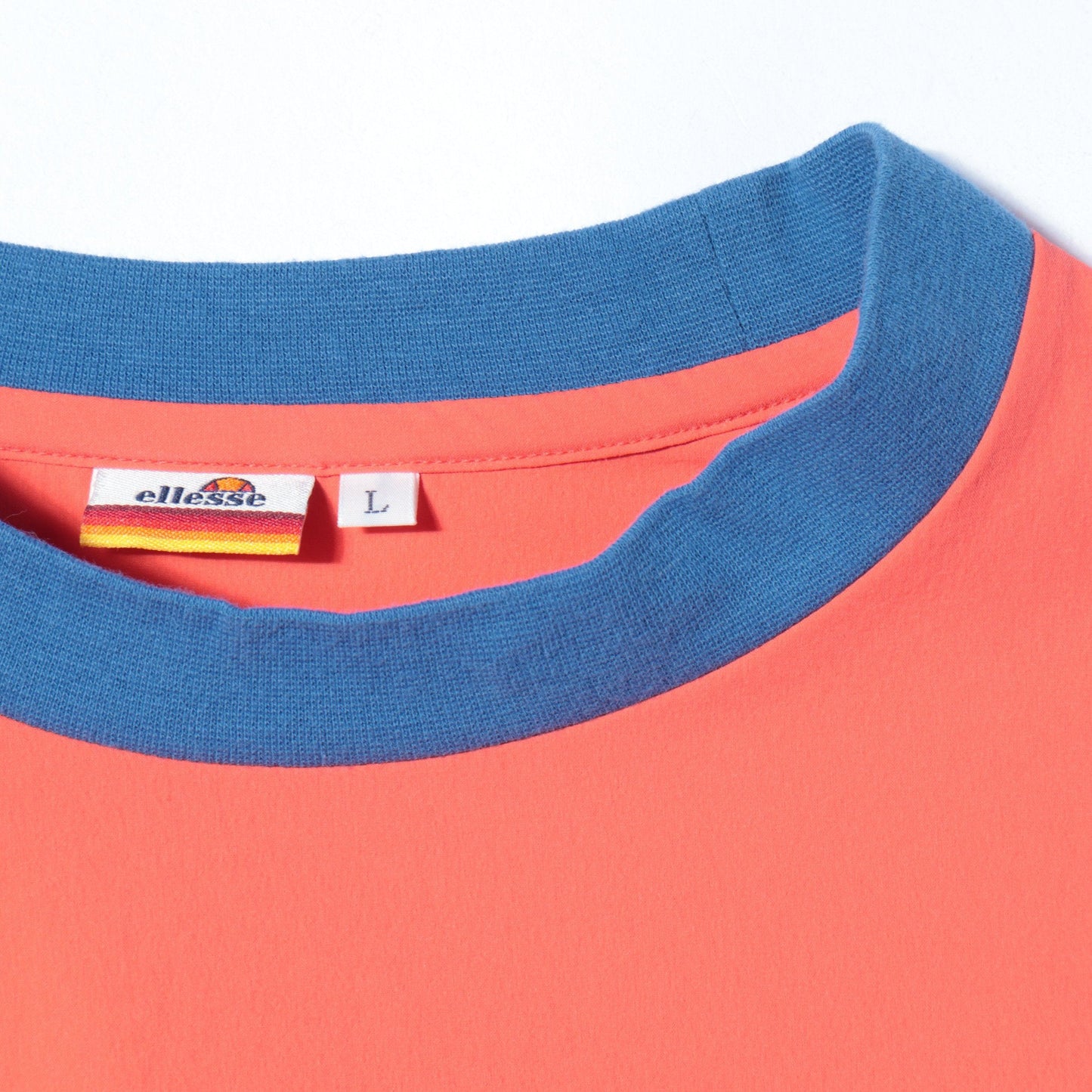 ellesse:ロゴハイブリッドTee